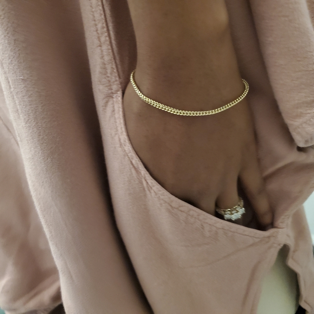 Mauve colored loose fitting peep shoulder blouse